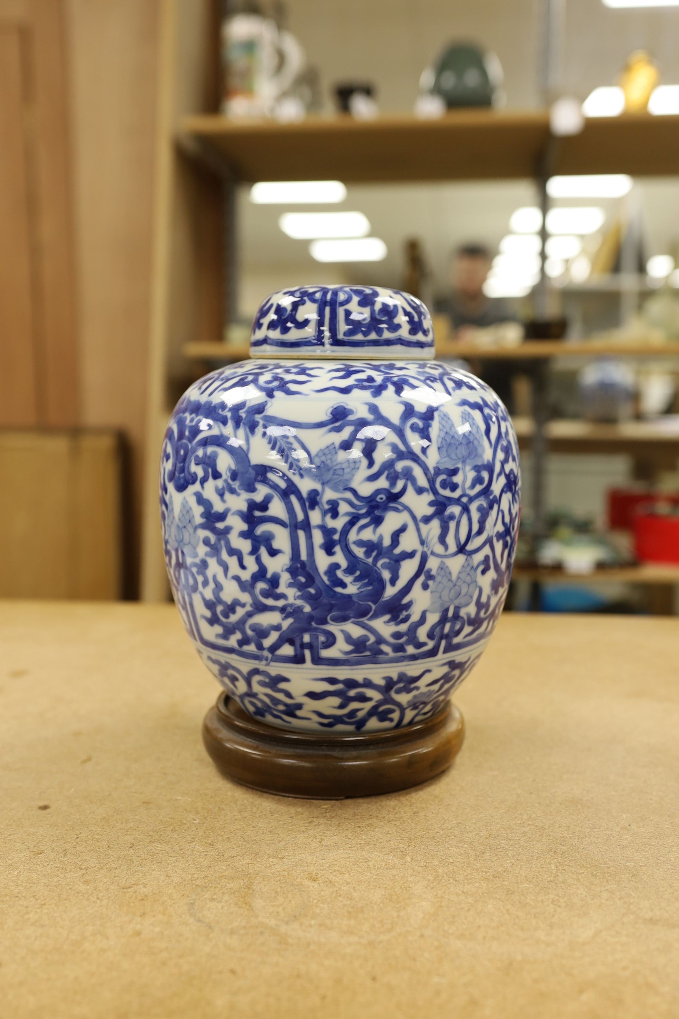 A pair of Chinese blue and white ginger jars and covers, 22cm, On stands